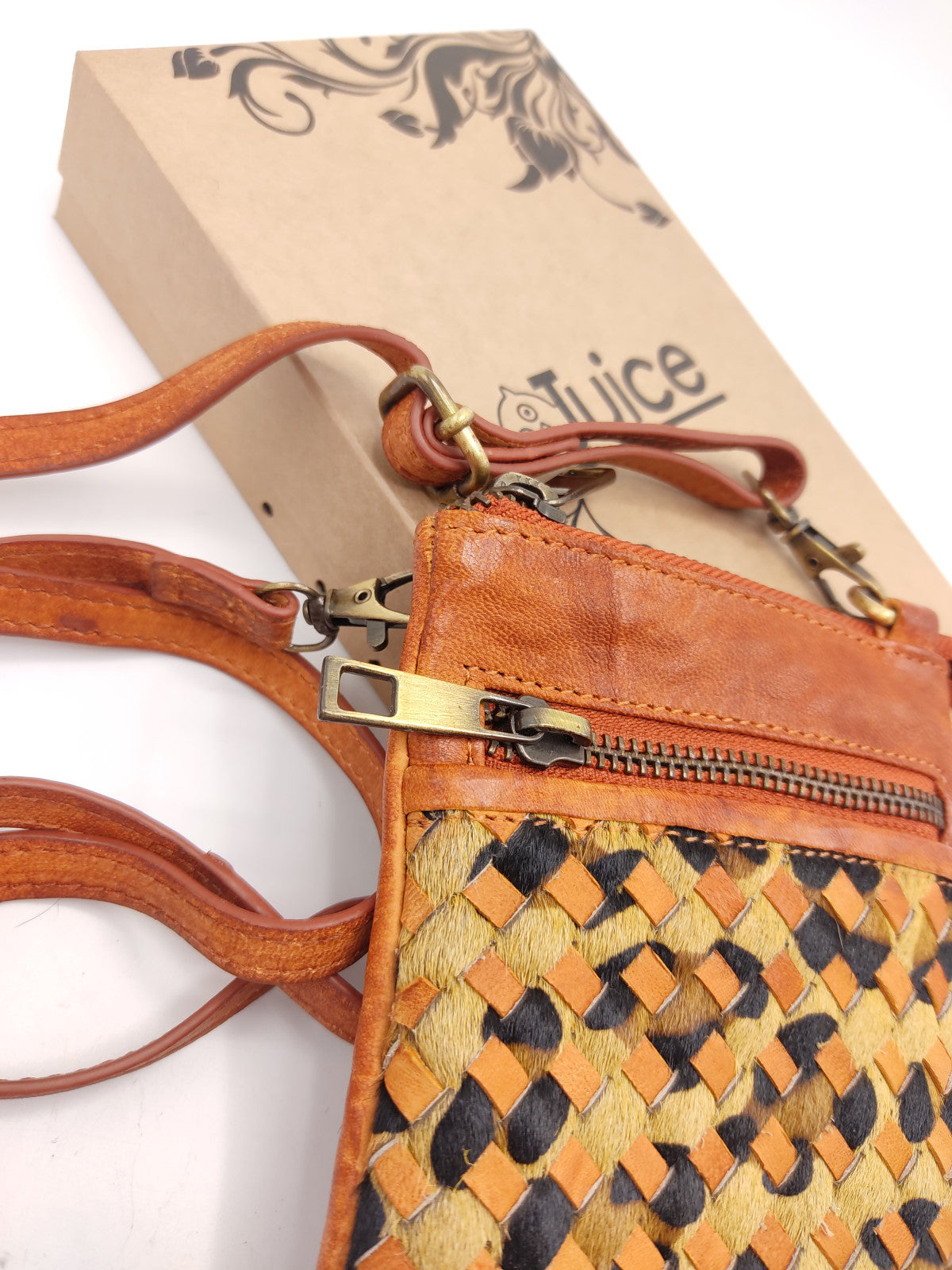 Washed leather and calf hair cellphone holder art. LE052.422